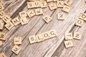 Blog spelled with letter tiles on a wooden desk